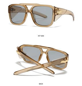 Detail view of champagne aviator sunglasses with gold metal hinges and side shields