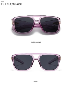 Detailed view of oversized square sunglasses with purple frames and golden hinge accents