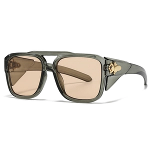 Modern vintage aviator sunglasses for women with transparent grey frames and gold accents