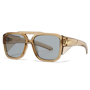Modern oversized champagne sunglasses with gray lenses and gold retro metal details
