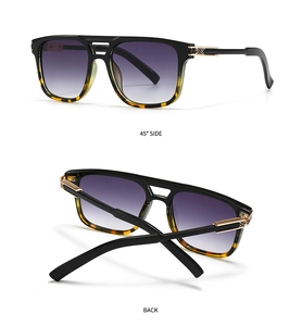 Détail des lunettes pilote avec verres dégradés violets et accents de charnière dorés