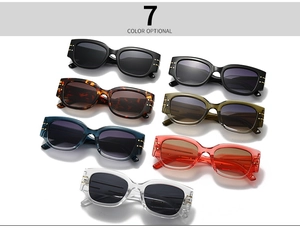 Close-up of cat-eye sunglasses in seven colors showing triple gold line detail on temples