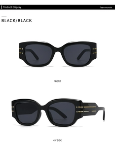 Macro detail of black cat-eye sunglasses featuring elegant gold metallic temple accents