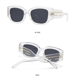 Detail of stylish cat eye sunglasses with gold metal bars and 45-degree side view