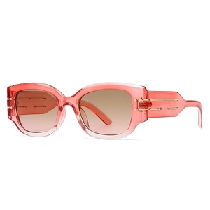 Modern vintage cat eye sunglasses with red transparent frames and gradient lenses