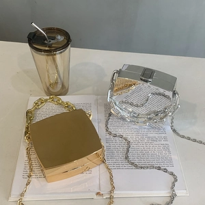 Metallic square box bag with chunky chain handle and silver strap in gold and silver