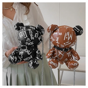 Detail of cute bear-shaped PU leather crossbody bags with graffiti prints and chain straps