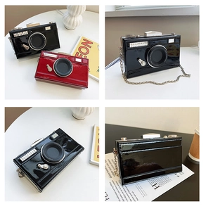 Detailed views of glossy patent leather camera-shaped crossbody bag with chain strap