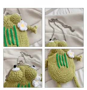 Detail view of handmade green knit frog purse with retro clasp and silver metal chain