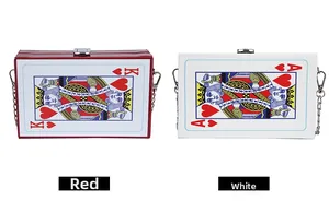Detail view of red and white playing card box clutches with metal chain straps