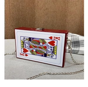 Close-up of heart King poker card print box bag with silver chain strap and metal lock