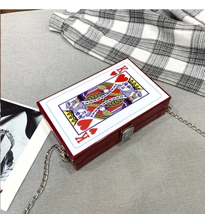 Detail of the creative playing card box bag with King of Hearts print and metal chain