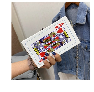 Close-up of Ace of Hearts playing card clutch bag with a slim silver chain strap