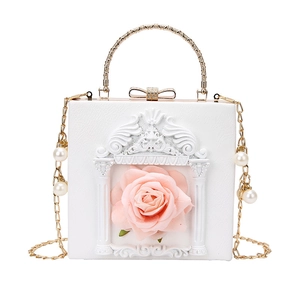 Baroque white box bag with 3D pink rose and gold handle shown in a front view