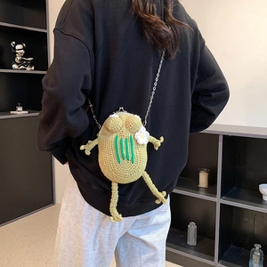 Handmade crochet frog crossbody bag with green knit pattern and vintage metal clasp