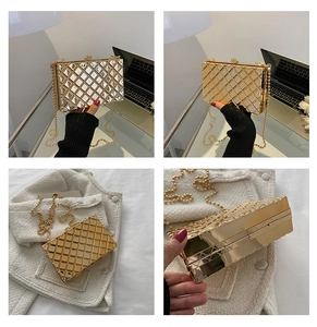 Detail view of a gold metallic box bag with quilted texture and beaded chain strap