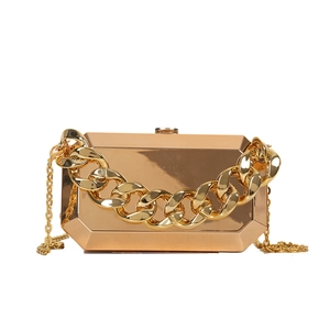 Golden geometric hardshell evening clutch bag with chunky chain and crossbody strap