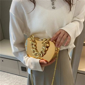 Chic gold metallic apple-shaped clutch bag with thick chain handle for women