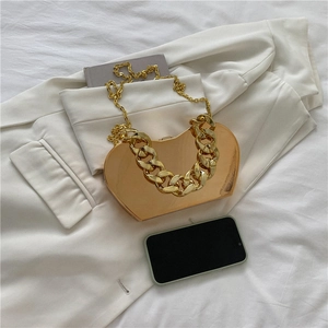 Metallic gold heart-shaped hard shell clutch with chunky chain strap for women
