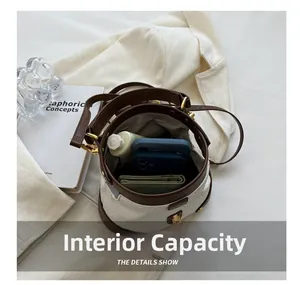 Internal view of litchi pattern bucket bag showing space for phones and wallet