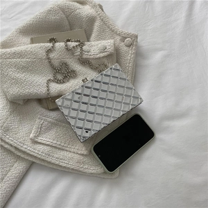 Chic silver metallic clutch bag with quilted pattern and elegant bead chain strap