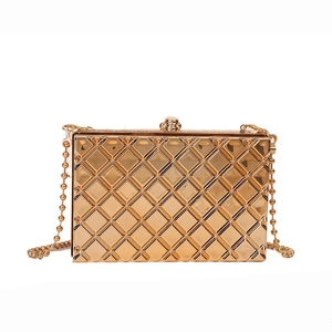 Chic gold metallic clutch bag with quilted texture and chain strap on white background