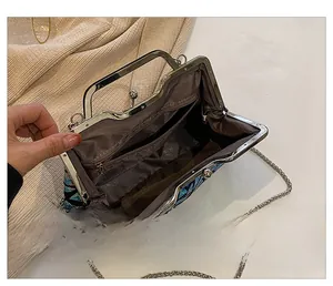 Detailed interior of sequin evening bag showing dark lining and zippered pocket