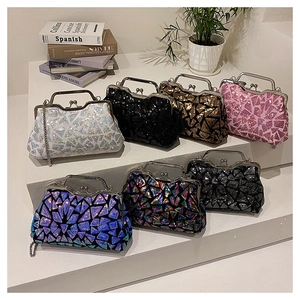 Macro shot of colorful sequin patterns and vintage metal clasp on a party clutch bag