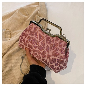 Detailed shot of pink sequined shell evening bag with vintage silver metal handle and clasp