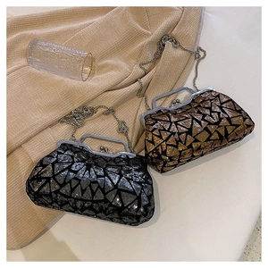 Detail of sequined evening bags with geometric patterns and metallic chain straps