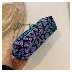 Detail of blue purple gradient sequins on cylindrical clutch with silver chain strap