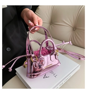 Detail of pink metallic mini tote bag with drawstring closure and shiny finish