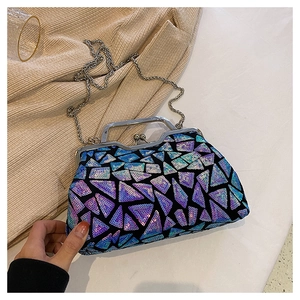 Detailed macro view of vibrant triangular sequins and vintage silver clasp on the clutch bag