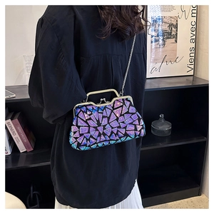 Detail of vintage sequin shell clutch bag with blue-purple gradient and silver chain strap