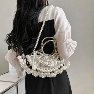 Elegant fan-shaped gold metal evening bag with pearl trim and silver inner pouch
