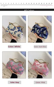Detail view of retro embroidery evening bags in white, navy, grey, and pink silk colors