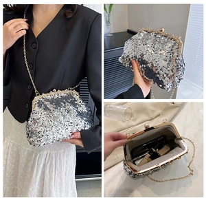 Macro view of sparkly sequin dinner clutch with gold metal frame and chain strap