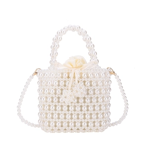 Elegant white pearl woven handbag with drawstring satin lining and gold crossbody strap