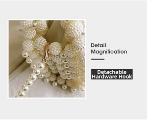 Detail magnification of detachable gold hardware lobster clasp on pearl woven handbag