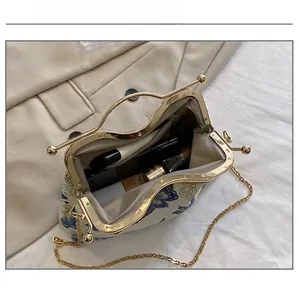 Detail view of the elegant vintage clutch interior showing capacity for cosmetics