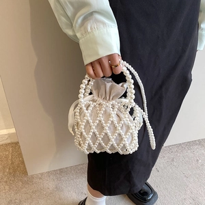 Handmade pearl woven bucket bag with inner drawstring pouch and pearl crossbody strap