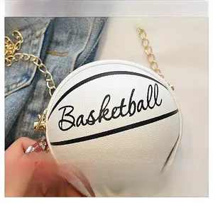 Macro shot of white basketball-shaped mini bag with gold chain and pebble leather