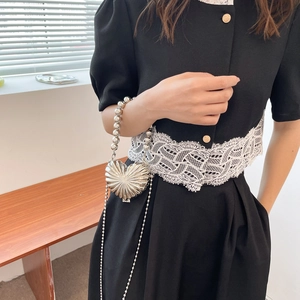 Metallic heart mini bag in bright silver with pearl handle and long chain strap
