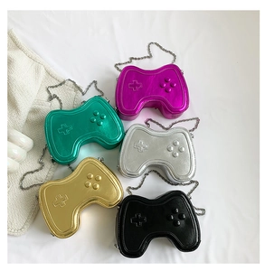 Detail of creative game controller shaped crossbody bags in five metallic colors