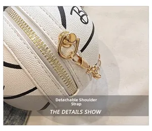 Detail view of mini basketball bag featuring white pebbled leather and golden chain hardware
