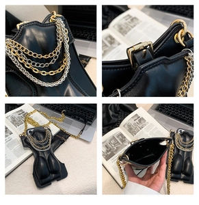 Detailed views of a black avant-garde mini crossbody bag with multi-layer metal chains
