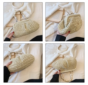 Detail of woven straw bag featuring a large marble bead handle and metal frame closure