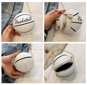 Close-up of white basketball shaped chain bag with litchi texture and gold hardware