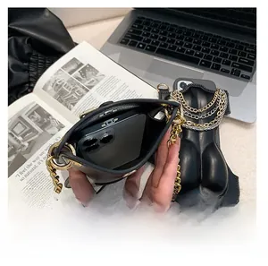 Internal view of creative body-shape black bag showing space for a smartphone