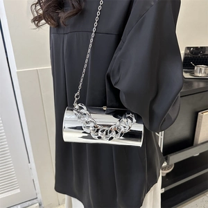 Silver metallic cylinder crossbody bag with thick decorative chain and glossy mirror finish